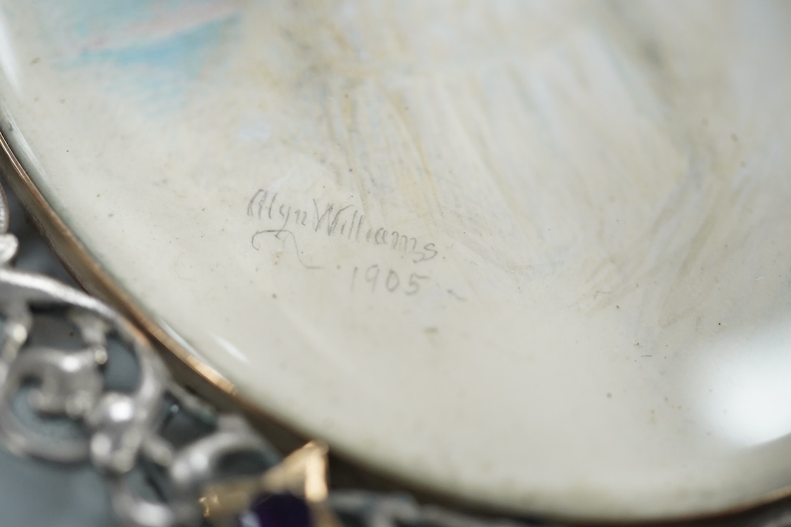 Alyn Williams (1866-1941), Portrait miniature of a young girl, signed and dated 1905, watercolour on ivory, guilloche enamel panel verso, housed in a white metal and amethyst set oval frame, overall 10cm high - CITES Sub